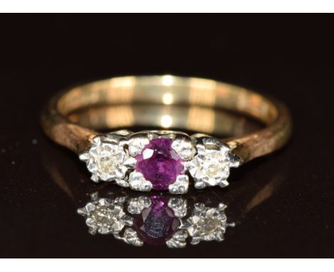 A 9ct gold ring set with a ruby and diamonds, 2.4g, size M