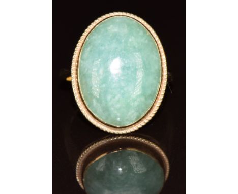 A 9ct gold ring set with a quartz cabochon, 5g, size P