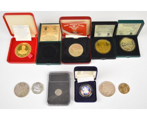 A group of mainly cased coins including three Isle of Man examples, one silver