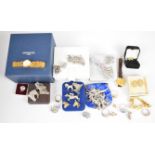 A collection of jewellery including silver charm bracelet, brooches including marcasite, Art Deco