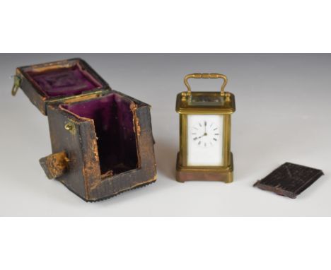 Brass miniature carriage clock with bevelled glass and white enamel dial, in original travel case, height of clock including 