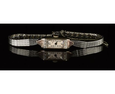 Art Deco 18ct gold ladies wristwatch set with blued hands, Arabic numerals, silver dial, diamond set case and mechanical move