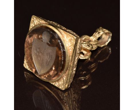 A 9ct gold seal set with a carved smoky quartz intaglio seal depicting a crest, 14.6g&nbsp;