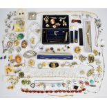 A collection of jewellery including silver bracelet, vintage and silver earrings, brooches including