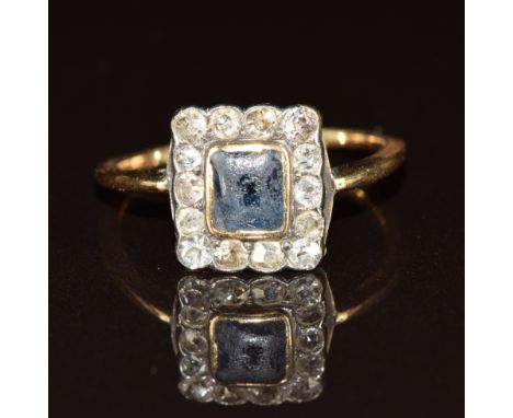 An 18ct gold ring set with a sapphire and diamonds, 2.2g, size O
