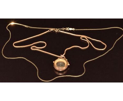 A 9ct gold compass pendant (Birmingham 1906) on 9ct gold chain (2g, 36cm) and a 14k gold chain (1.5g, 42cm)
