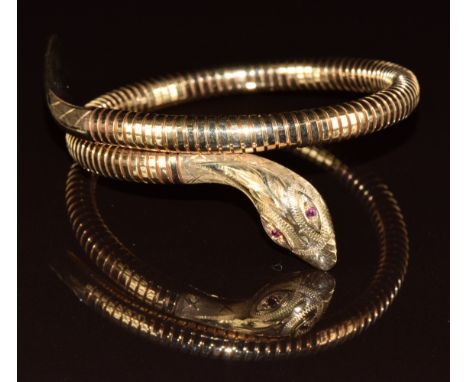 A 9ct gold bangle in the form of a serpent set with ruby eyes, Birmingham 1995, 25.6g