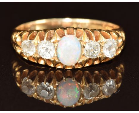 Victorian 18ct gold ring set with an opal cabochon and four old cut diamonds, 4.8g, size N