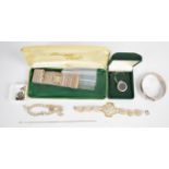 A collection of silver jewellery including Wedgwood pendant, bangle, charm bracelet, filigree