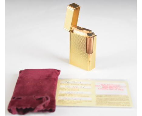 St Dupont gold plated lighter with textured finish, ref 14301 with After Service Guarantee Card.&nbsp;