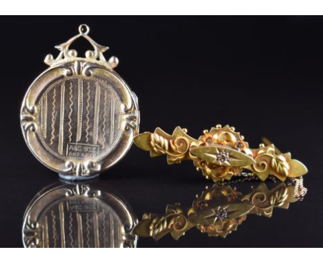A 15ct gold brooch set with a rose cut diamond (3g, Birmingham 1913) together with an Art Deco 9ct gold back and front locket