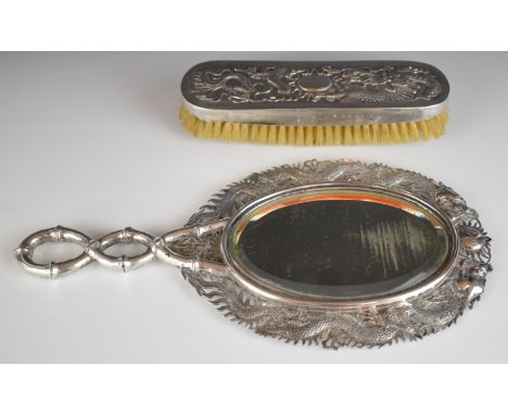 Wang Hing Chinese silver mirror with raised dragon decoration and bamboo handle, together with a similar brush, length of mir