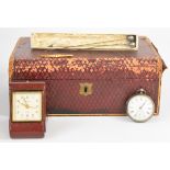 A silver pocket watch, three hatpins including two with white metal tops, travelling clock and
