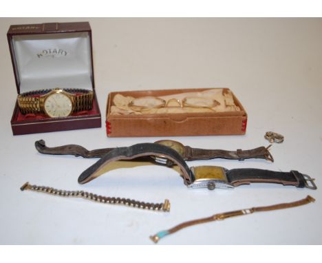 A gents Rotary steel cased wristwatch, having champagne dial with baton markers, date aperture and quartz movement, boxed; to