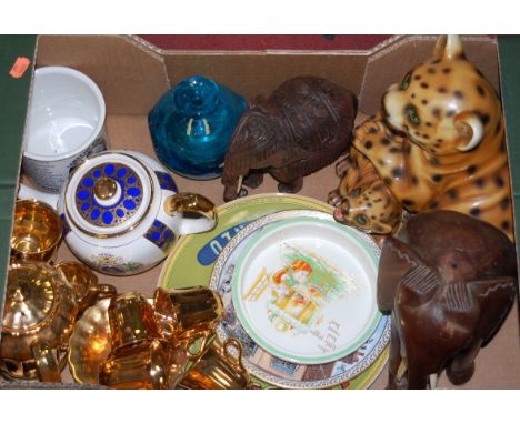 A box of miscellaneous items, to include; a Wade gilt tea service, Mdina glass vase, and a carved figure of an elephant etc 