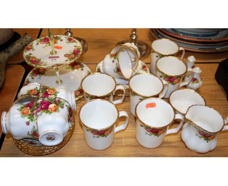 A Royal Albert six place setting tea service, in the Old Country Roses pattern; together with matching mugs and cruet etc 