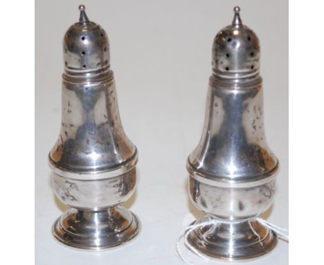 A pair of early 20th  century sterling silver lighthouse pepperettes