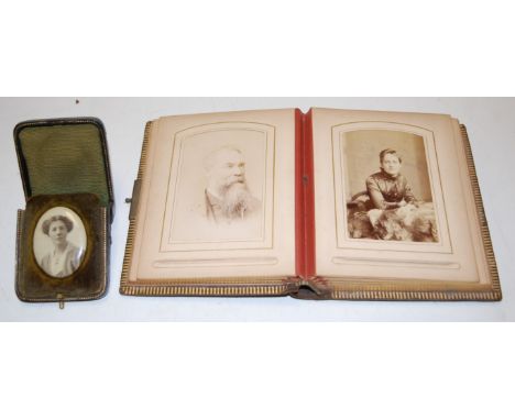A Victorian leather bound photograph album and contents, mainly being portraits; together with one other leather cased portra