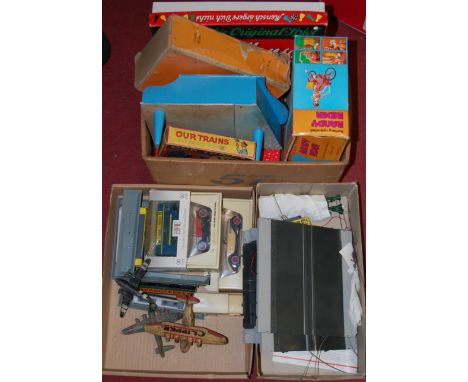 Two boxes containing children's board games, diecast collectables and H0 scale railways, examples to include a Matchbox Model