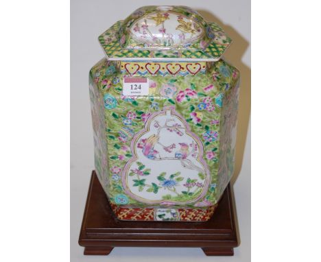 A Chinese famille verte porcelain jar and cover, of hexagonal baluster form, each panel enamel decorated with bird amongst br