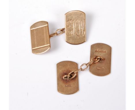 A pair of 9ct cufflinks, the rectangular panels with engine turned engraving and initials WHW, (4.6g), cased