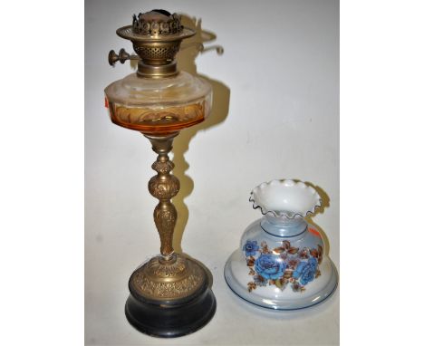 A circa 1900 brass pedestal oil lamp having opalescent frilled glass shade and clear glass reservoir on brass column and socl