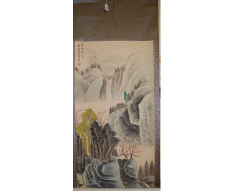 A Chinese scroll painting depicting mountain landscape, signed and with seal mark 