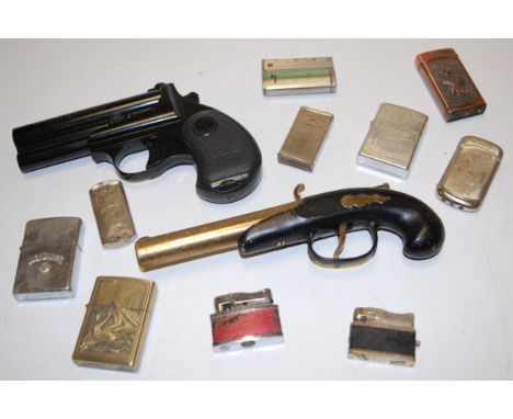 A novelty table cigarette lighter in the form of a flintlock pistol; together with various other pocket cigarette lighters 