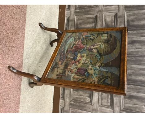 MAHOGANY AND WALNUT FOLDING FIRESCREEN/TABLE
inset with machined tapestry panel of carousing figures, 56cm wide