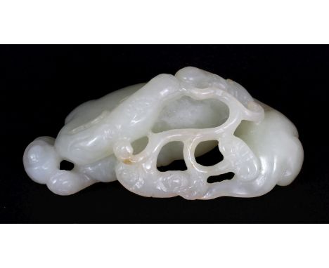 A CHINESE CELADON JADE MODEL OF TWO KYLIN, one bearing a frond of lingzhi in its mouth, 3in(7.5cm) wide & 1.1in(2.7cm) high.