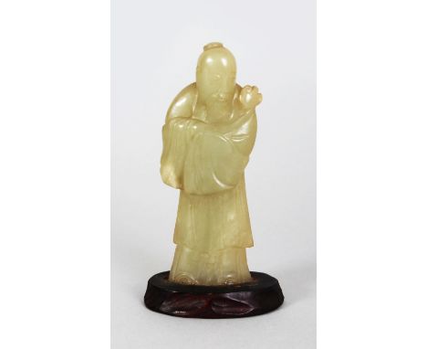 AN 18TH/19TH CENTURY CHINESE CELADON JADE FIGURE OF SHOU LAO, together with a fixed wood stand, the deity bearing a ruyi scep