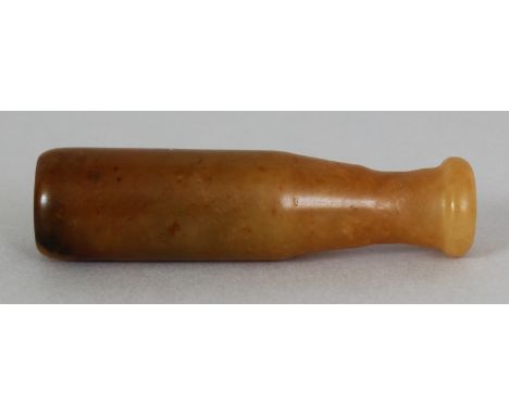 A CHINESE JADE CIGARETTE HOLDER, the stone of predominantly brown tones, 2.6in(6.5cm) long.