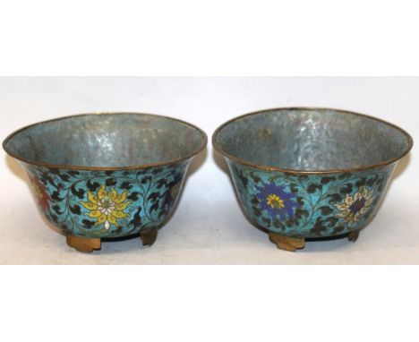 A PAIR OF 19TH CENTURY ORIENTAL MING STYLE CLOISONNE BOWLS, each decorated on a turquoise ground with a formal design of scro