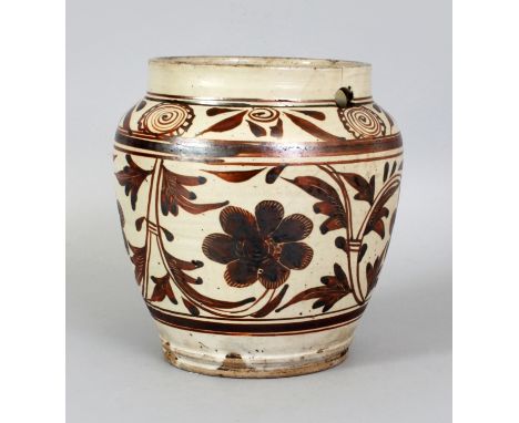 A CHINESE YUAN/MING DYNASTY CIZHOU CERAMIC JAR, the sides decorated in brown on a cream ground with formal scrolling foliage,