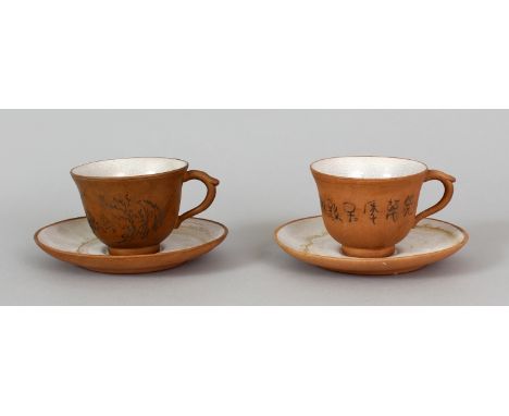 A NEAR PAIR OF 19TH/20TH CENTURY PARTIALLY GLAZED YIXING POTTERY TEA CUPS & SAUCERS, each piece applied to its interior with 