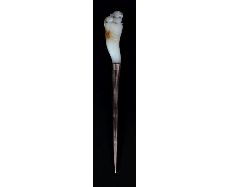 A CHINESE WHITE JADE & METAL HAIR PIN, the jade with a buddhistic lion finial and with russet inclusions, 6.3in(16.2cm) long,