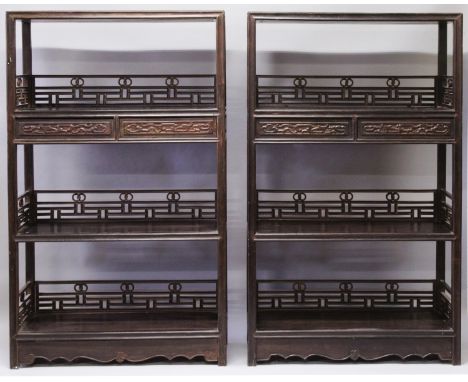 A GOOD PAIR OF LARGE CHINESE HARDWOOD STANDING OPEN DISPLAY SHELVES, very heavy in weight, each with three shelves and pierce