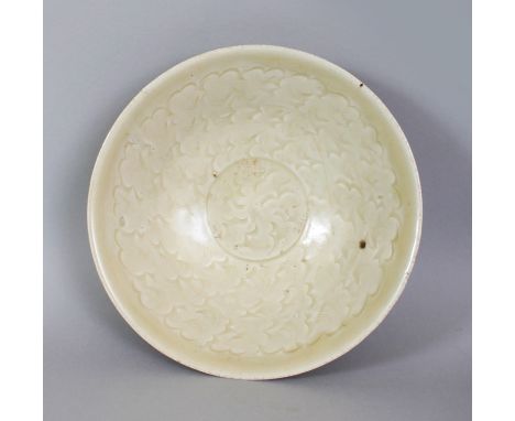 A CHINESE SONG DYNASTY CELADON PORCELAIN BOWL, possibly Yaozhou ware, the glaze of olive tone, the interior decorated beneath