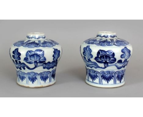 A PAIR OF CHINESE KANGXI PERIOD BLUE & WHITE PORCELAIN VASES, circa 1700, each painted with scrolling flowers and leafage, be