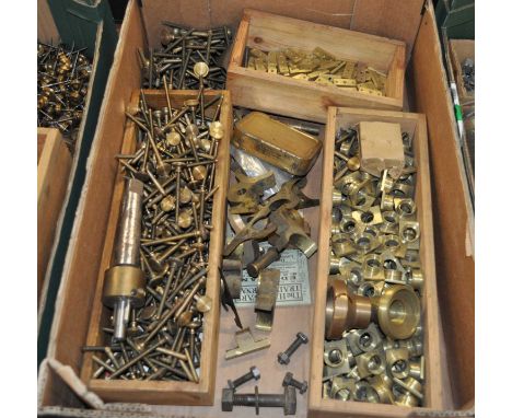 A collection of brass barometer components to include portable screws, capitals, portable screw flat plates, etc 