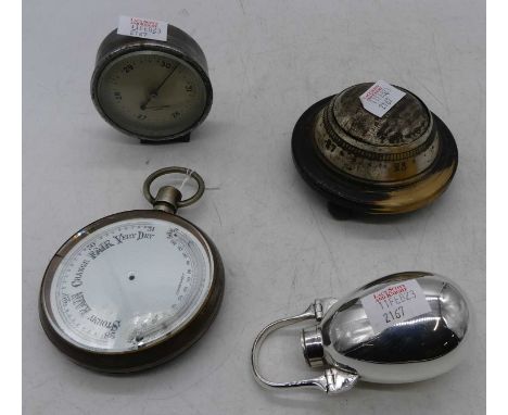 A gunmetal cased oversized pocket barometer (incomplete) dia. 10.5cm, a Negretti &amp; Zambra desk top barometer, base metal 