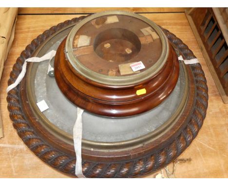 A Victorian carved oak oversized aneroid barometer case of circular form with ropetwist border, dia. 60cm, together with one 