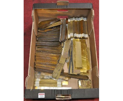 A large collection of brass thermometer scales