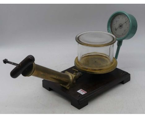 An early 20th century British made vacuum aneroid barometer, all raised upon oak plinth