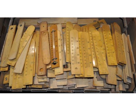 A large collection of boxwood thermometer scales, largely being bow topped