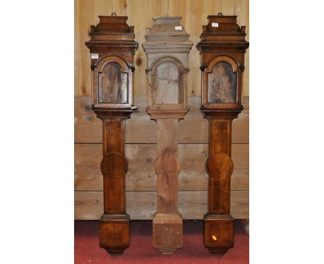 Two walnut Hallifax barometer frames together with pine carved example, h.124cm (3)