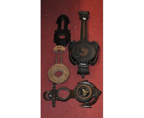 A late Victorian carved oak wheel barometer case, having rams head mounts and beaded decoration, 95cm (a/f); together with th