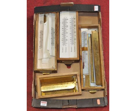 A large collection of thermometer scales in brass and card