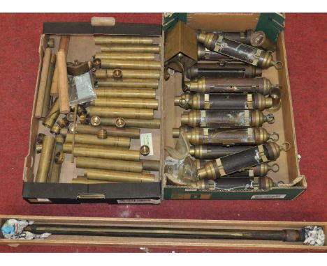 A collection of brass marine barometer cisterns together with a single marine barometer standard frame