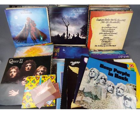 A box of 12" vinyl records to include Deep Purple, Queen, Whitesnake, Rolling Stones, ZZ Top, The The, John Lennon and others